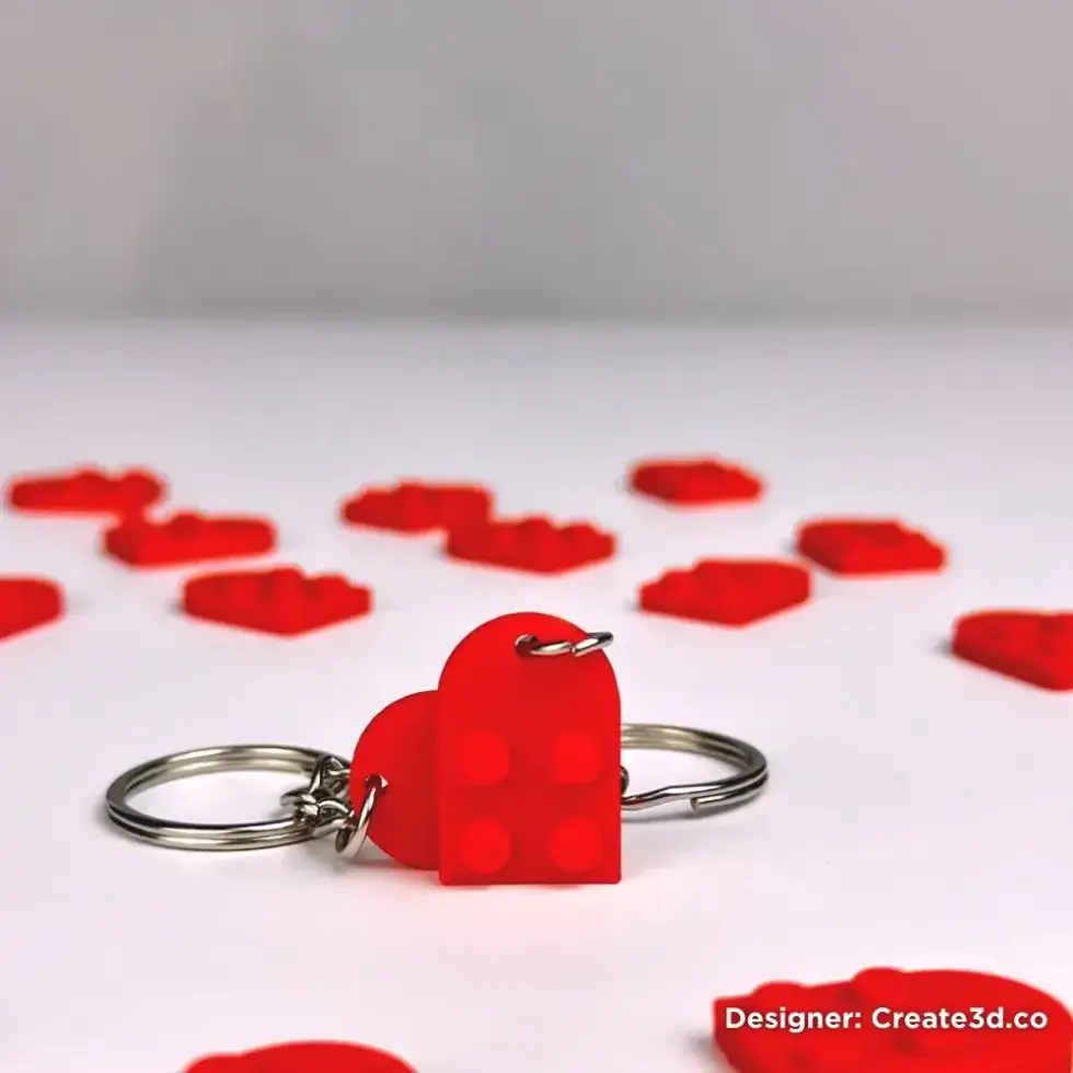 red lego-style heart shaped keychain on a keychain ring